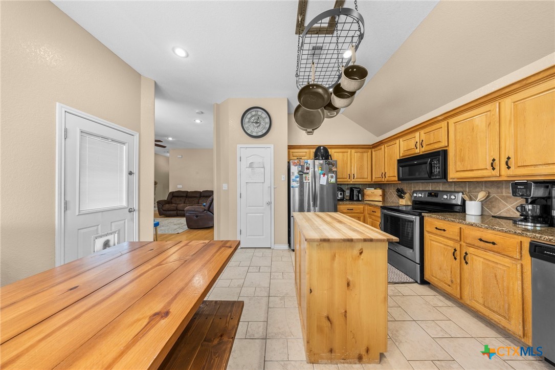 108 Gehler Circle Nolanville, TX 76559 - Photo 14 of 27 a large kitchen with stainless steel appliances granite countertop a stove and a sink