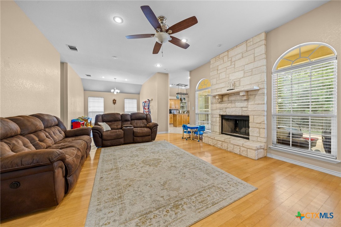 108 Gehler Circle Nolanville, TX 76559 - Photo 5 of 27 a living room with furniture a fireplace and a flat screen tv