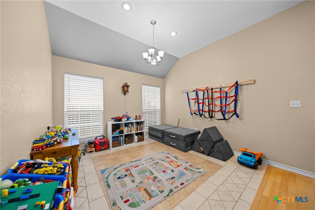 108 Gehler Circle Nolanville, TX 76559 - Photo 7 of 27 a bedroom with furniture and a wooden floor