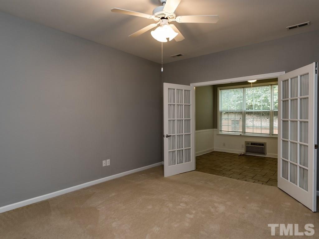 10483 Dapping Drive Raleigh, NC 27614 - Photo 11 of 21 an empty room with windows and ceiling fan