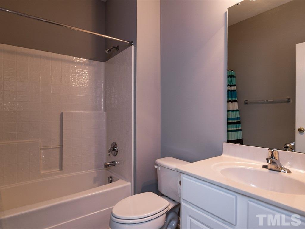 10483 Dapping Drive Raleigh, NC 27614 - Photo 16 of 21 a bathroom with a sink a toilet and shower