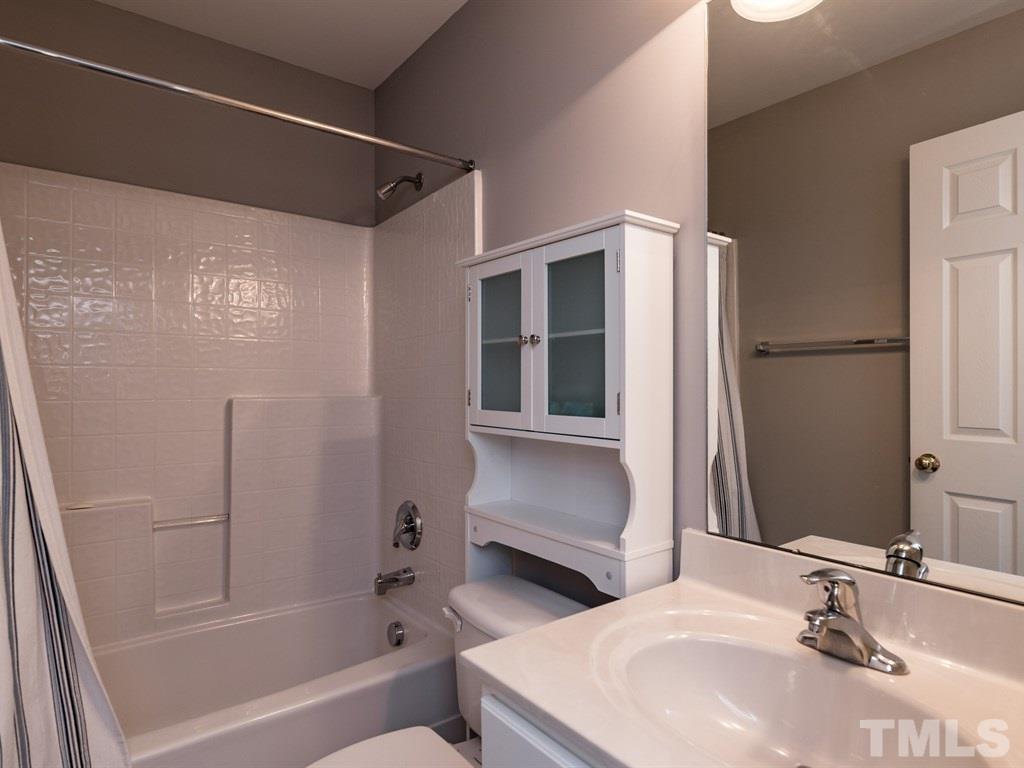 10483 Dapping Drive Raleigh, NC 27614 - Photo 19 of 21 a bathroom with a sink and a mirror