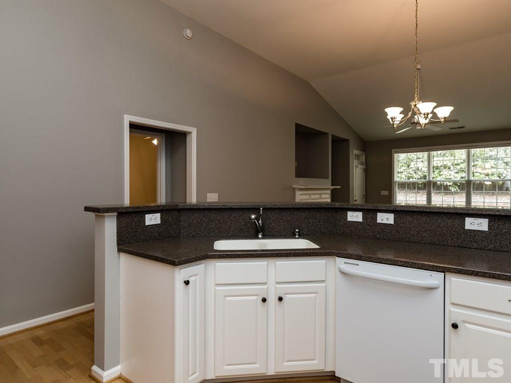 10483 Dapping Drive Raleigh, NC 27614 - Photo 21 of 21 a bathroom with a sink and a mirror