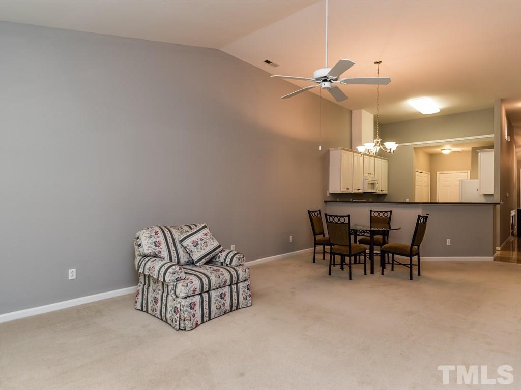 10483 Dapping Drive Raleigh, NC 27614 - Photo 8 of 21 a dining room with furniture and a chandelier