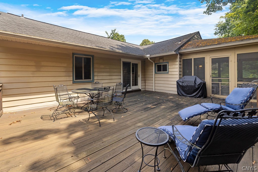 108 Archer Road Syracuse, NY 13207 - Photo 20 of 44 Large deck off the screened in porch