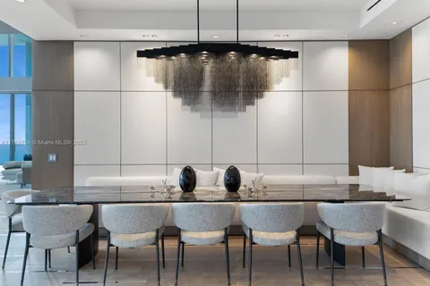 a kitchen with a sink refrigerator and cabinets