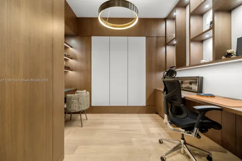 a bedroom with a bed and a potted plant