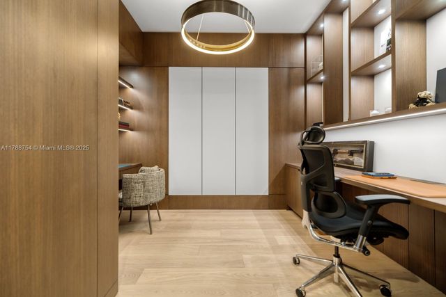 a bedroom with a bed and a potted plant