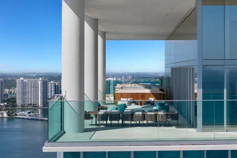 an outdoor view of house with deck and outdoor seating