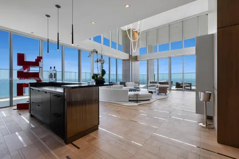 a kitchen with granite countertop a stove and cabinets