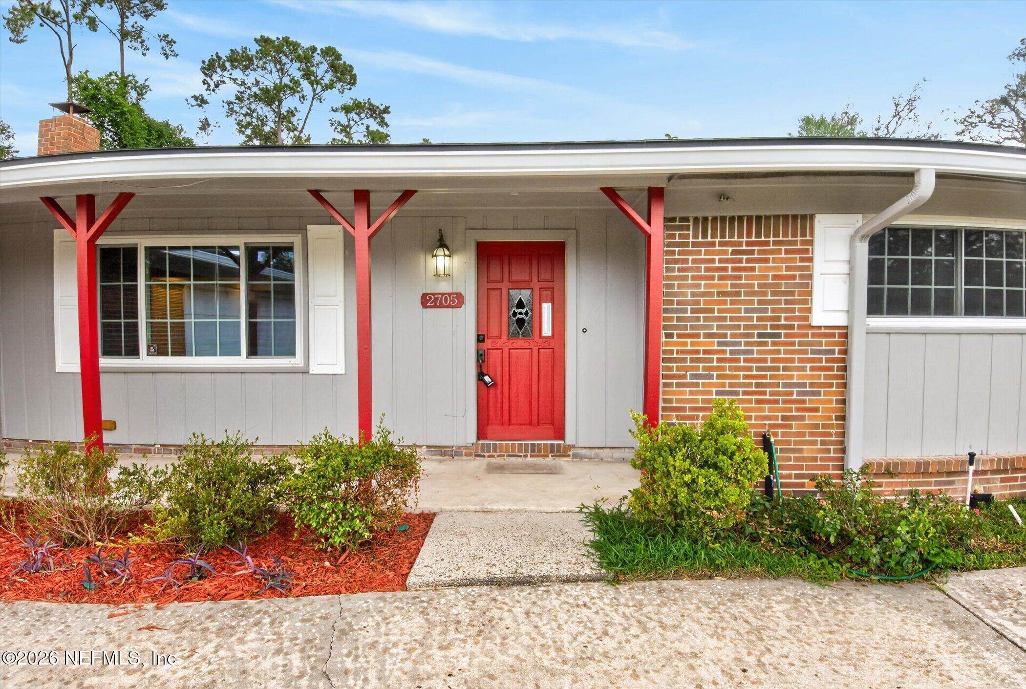2705 Navajo Road Orange Park, FL 32073 - Photo 7 of 58 a front view of a house with a yard