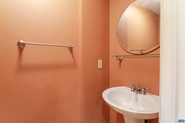 a bathroom with a sink and mirror