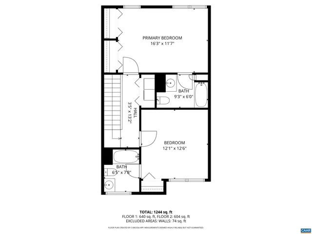 a picture of a bench in front of a wall