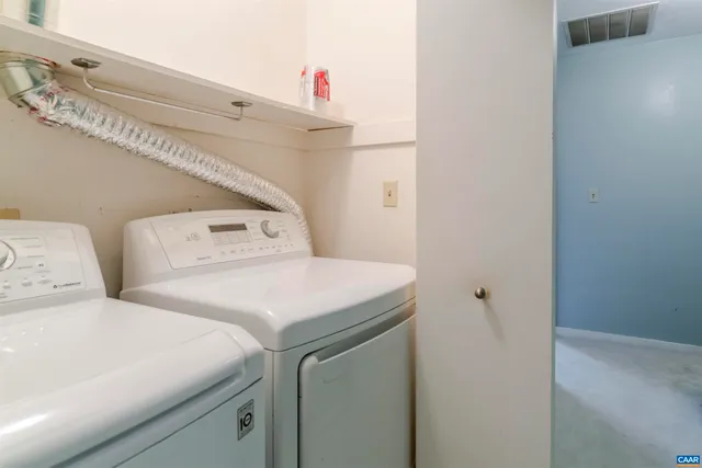 a bathroom with a sink toilet and a mirror