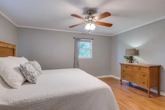a bedroom with a bed and a dresser