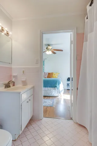 a spacious bedroom with a bed and window