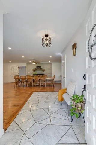 a lobby with furniture and a rug