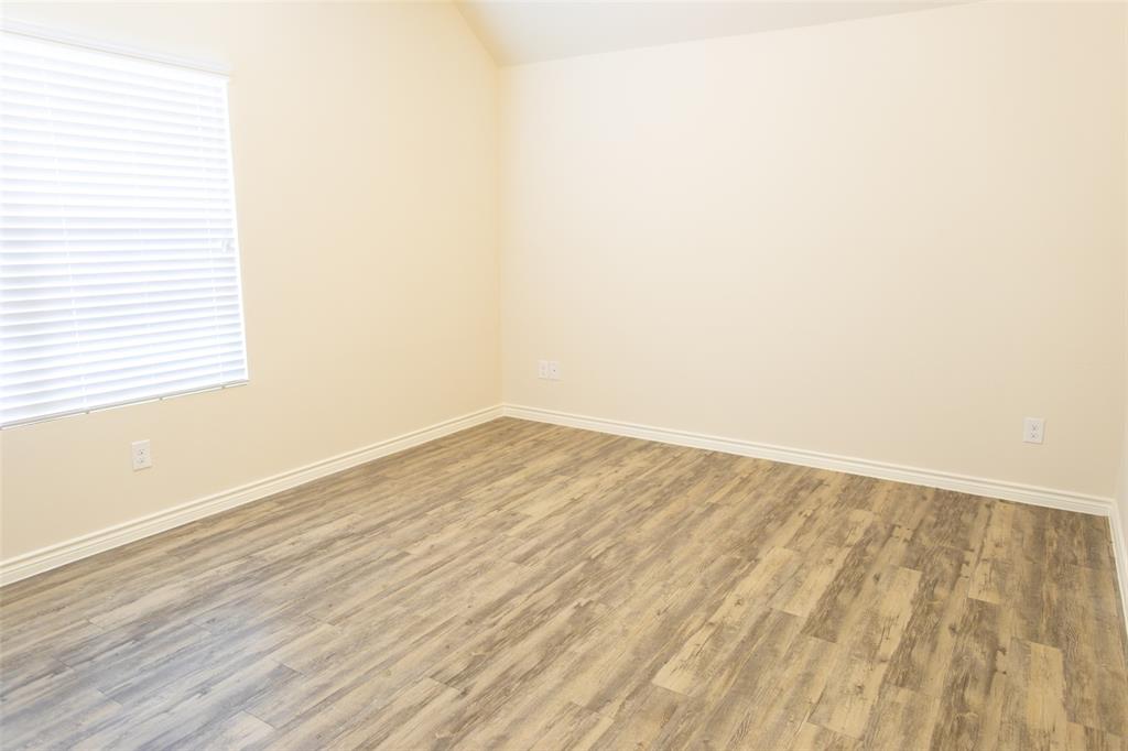 3526 Apple Valley Way Dallas, TX 75227 - Photo 9 of 13 a view of empty room with wooden floor and fan