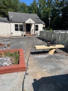 4654 Hope Springs Road Stone Mountain, GA 30083 - Photo 11 of 18 a view of a white house with a yard