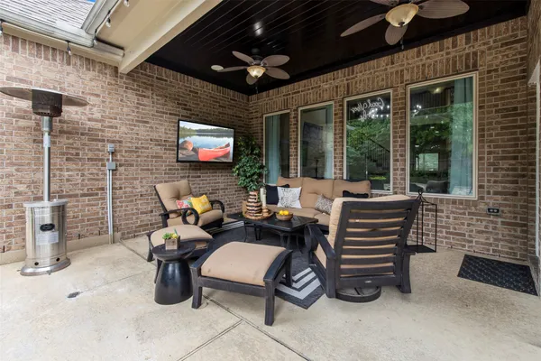 a outdoor space with patio furniture and windows