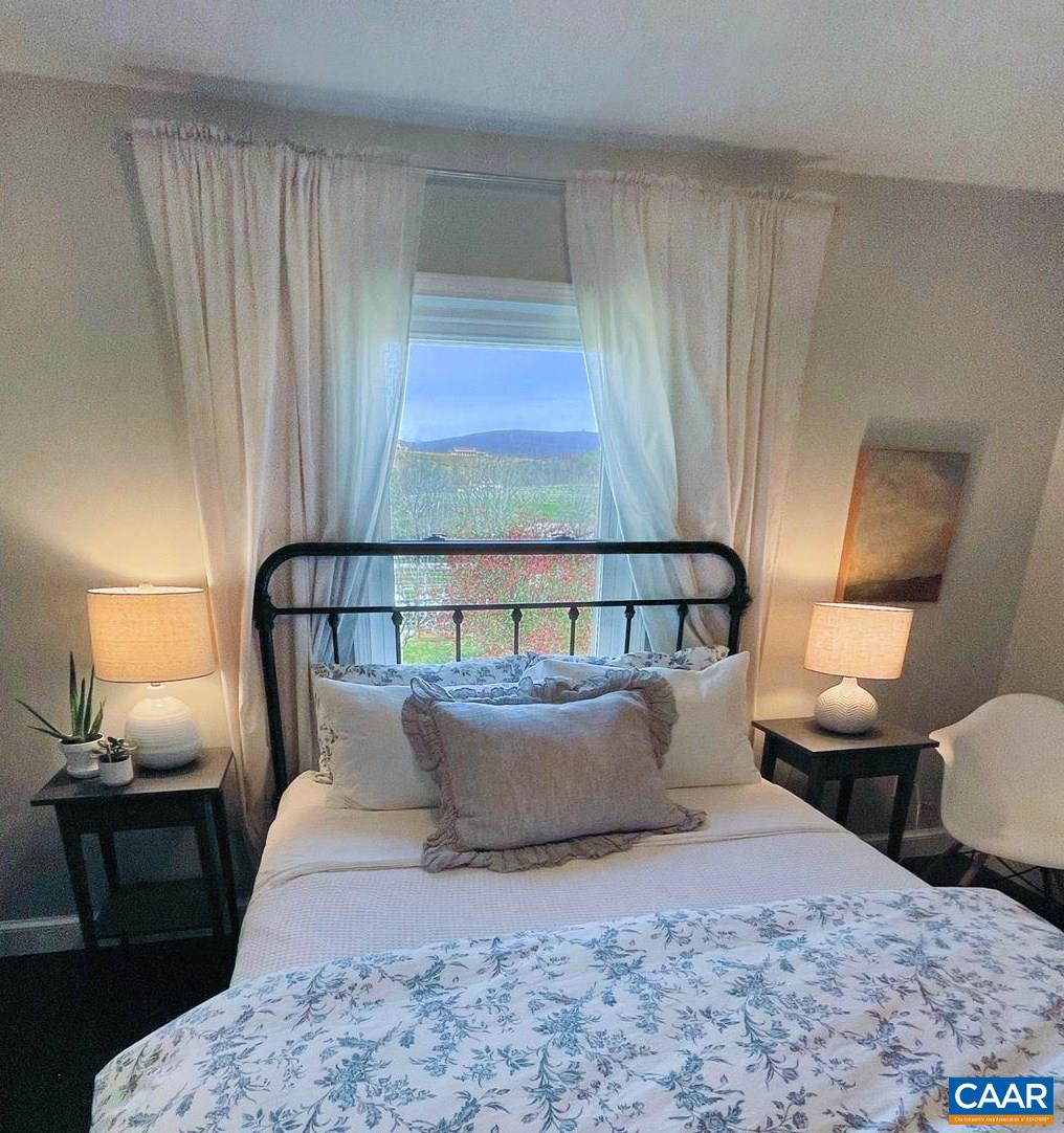 923 Smith Road Afton, VA 22920 - Photo 13 of 34 a bed room with a bed and a night stand