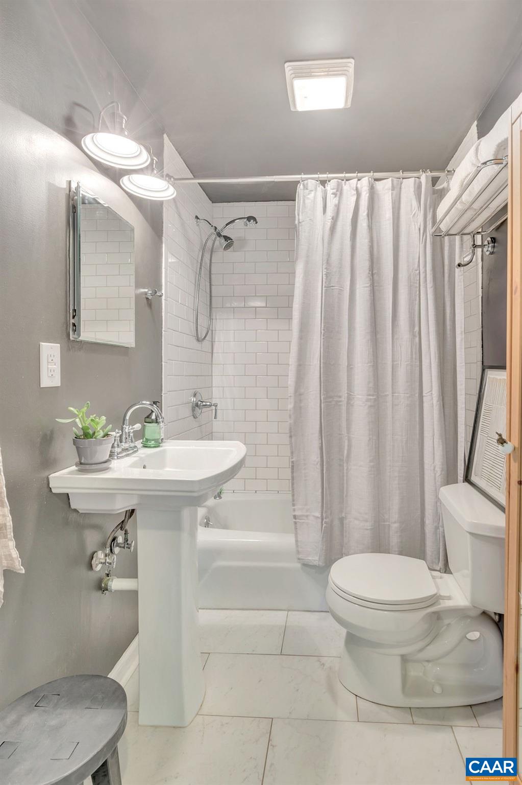 923 Smith Road Afton, VA 22920 - Photo 14 of 34 a bathroom with a sink toilet and shower