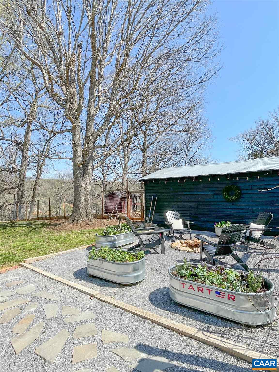 923 Smith Road Afton, VA 22920 - Photo 25 of 34 a front view of a house with garden and trees