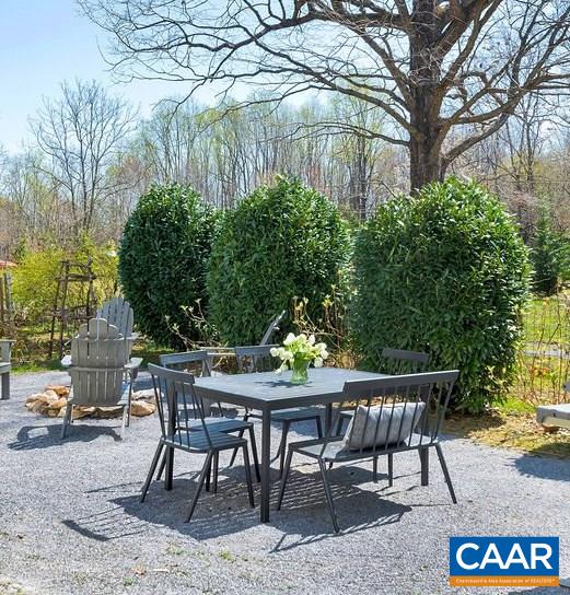 923 Smith Road Afton, VA 22920 - Photo 8 of 34 a patio with table and chairs and potted plants
