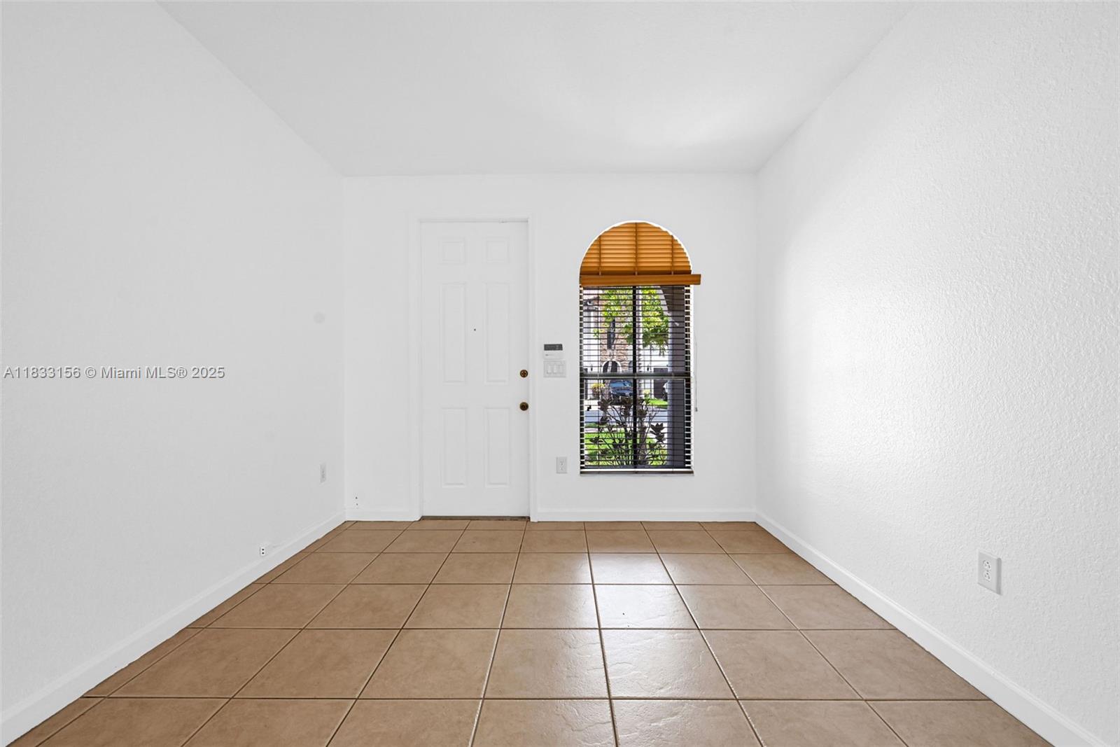 Doral Doral, FL 33172 - Photo 13 of 63 a view of an empty room with a window
