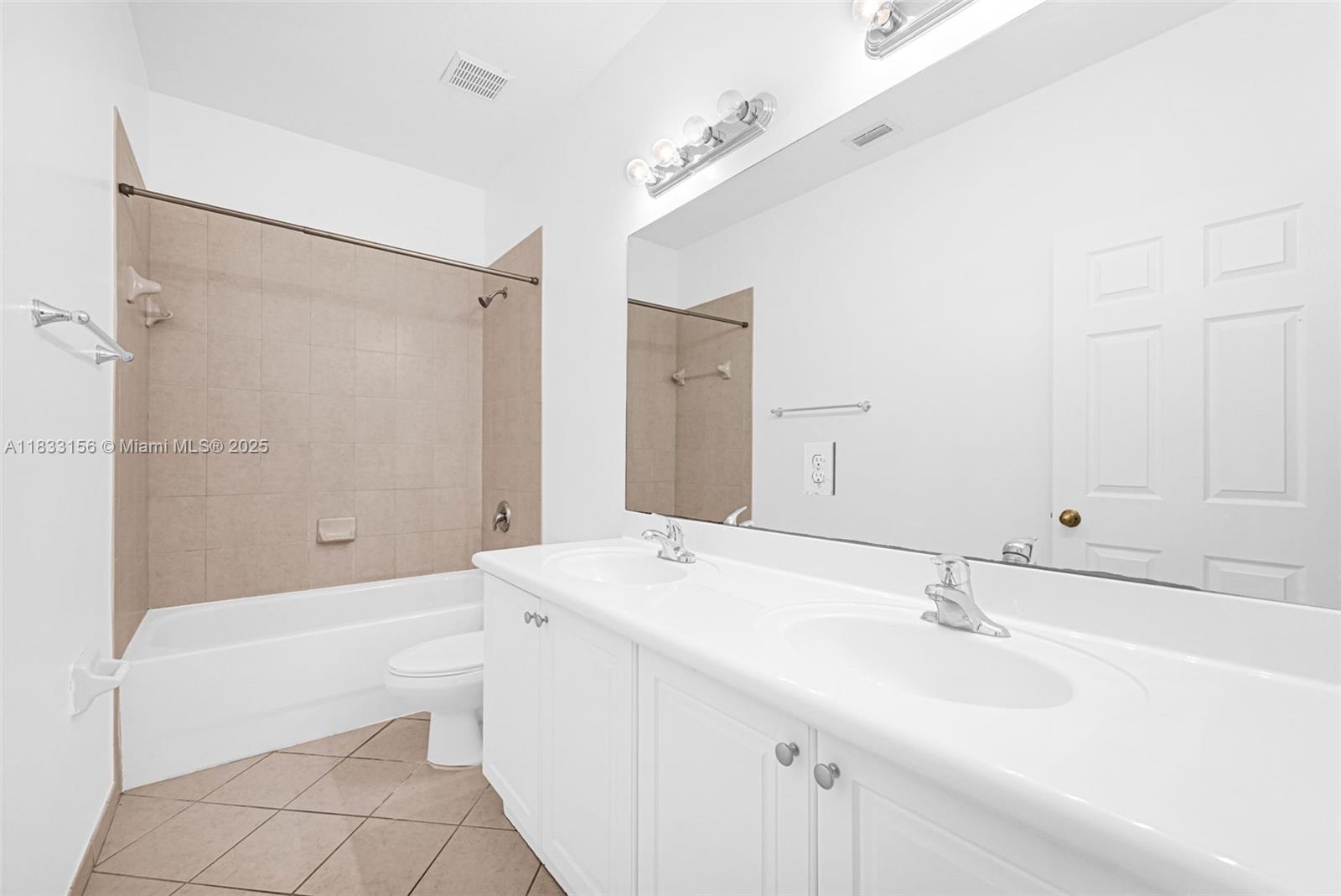 Doral Doral, FL 33172 - Photo 60 of 63 a bathroom with a sink a toilet and shower