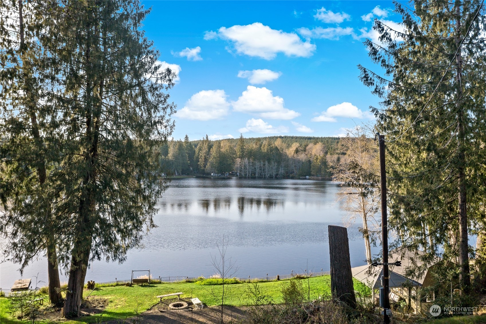 481 Arrowhead Drive Elma, WA 98541 - Photo 1 of 32 a view of a lake with a yard