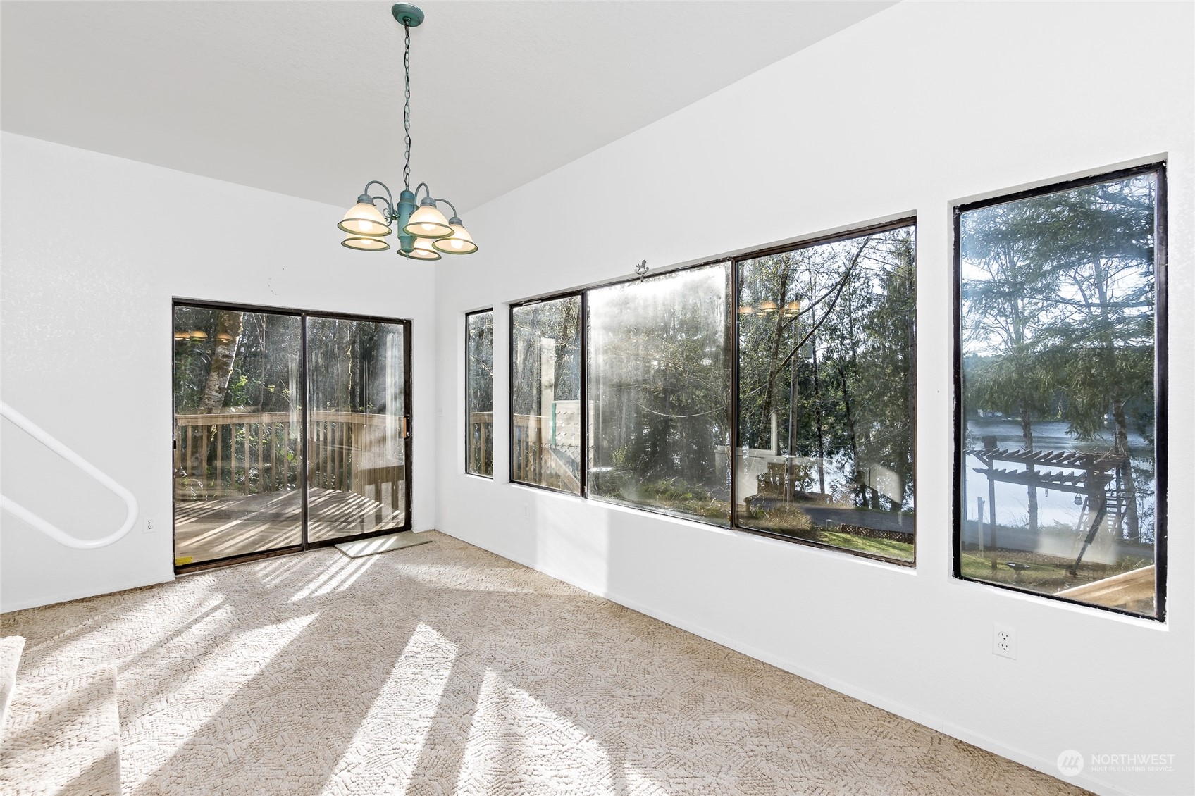 481 Arrowhead Drive Elma, WA 98541 - Photo 21 of 32 a view of a room with balcony wooden floor and windows