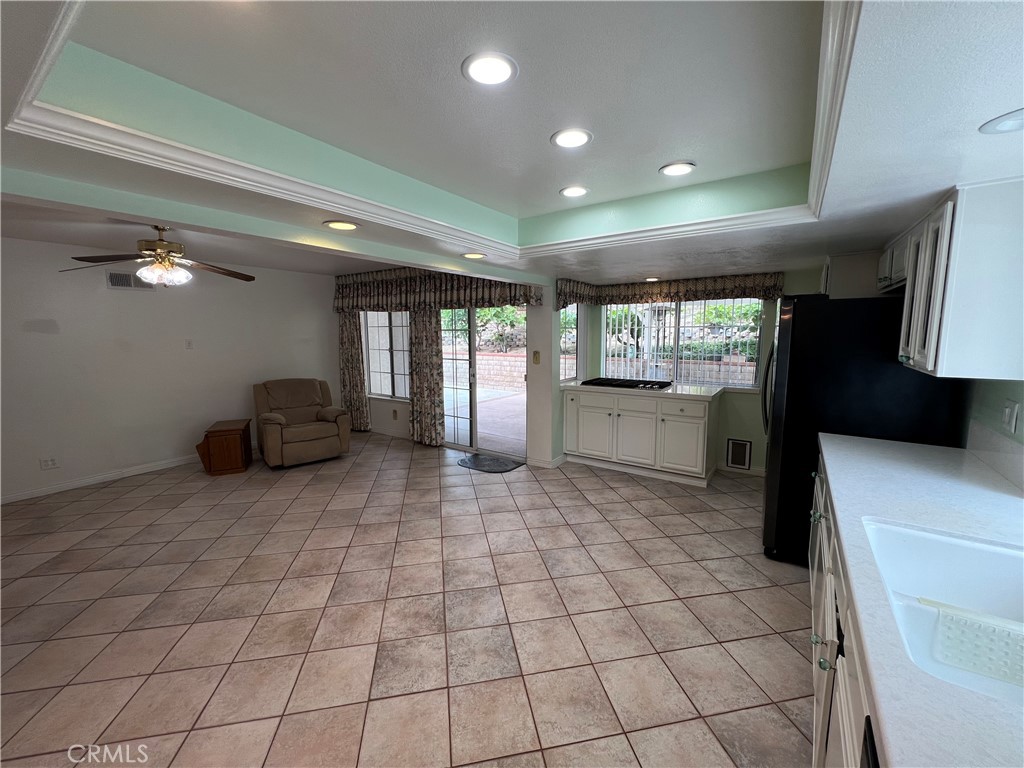 25225 Sagecrest Circle Stevenson Ranch, CA 91381 - Photo 22 of 50 Kitchen to den. Coffered ceiling with can lights