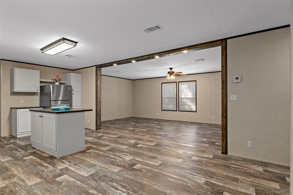 2455 East North Street Inverness, FL 34453 - Photo 15 of 27 a view of a kitchen with a sink and refrigerator