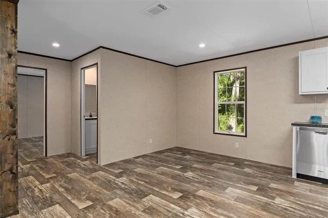 a view of an empty room and window