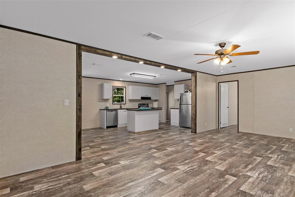 2455 East North Street Inverness, FL 34453 - Photo 5 of 27 a view of a kitchen with a sink and a refrigerator
