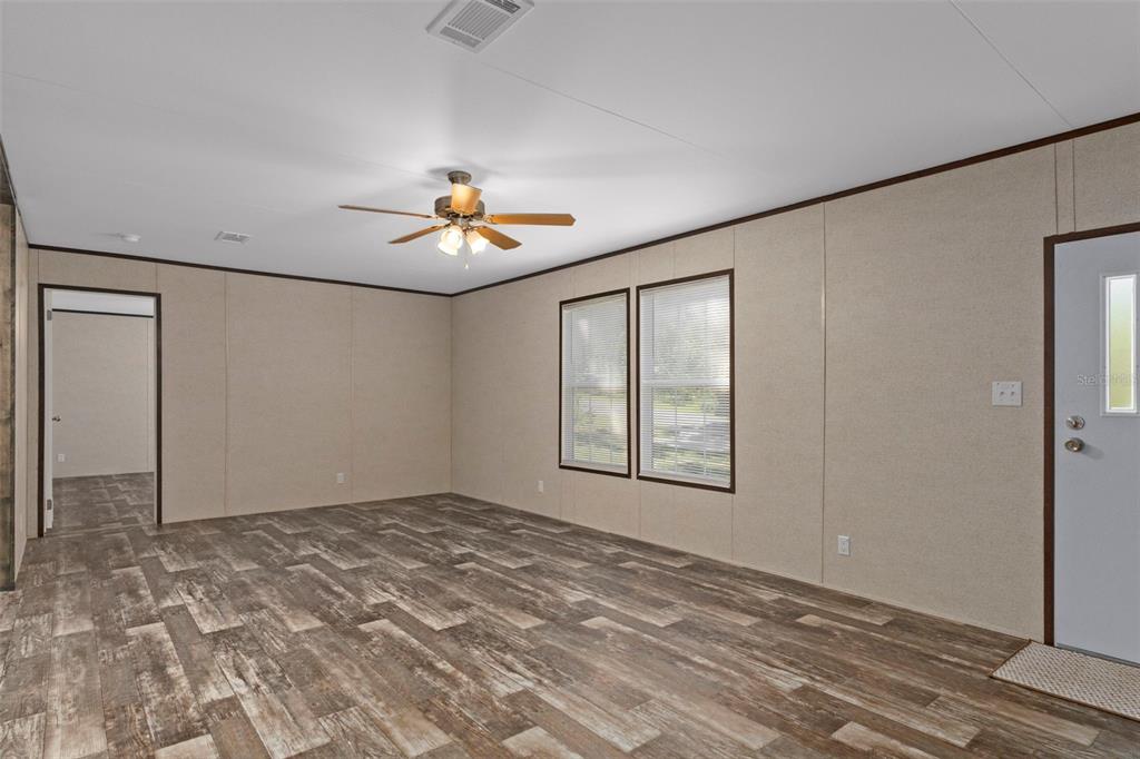 2455 East North Street Inverness, FL 34453 - Photo 6 of 27 a view of an empty room with a window