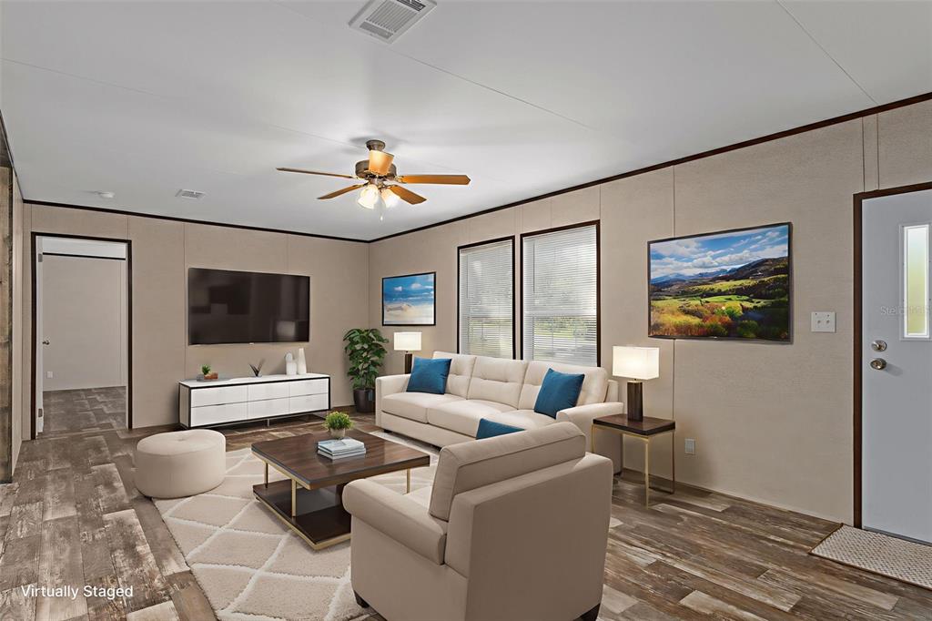 2455 East North Street Inverness, FL 34453 - Photo 7 of 27 a living room with furniture and a flat screen tv