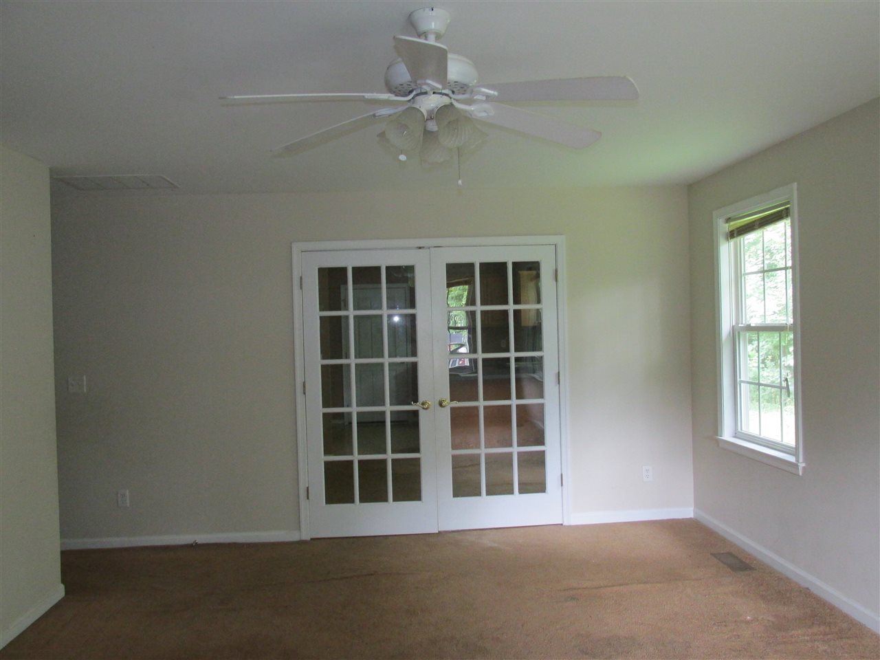 109 Fairview Road Louisa, VA 23093 - Photo 2 of 8 a view of an empty room with a window