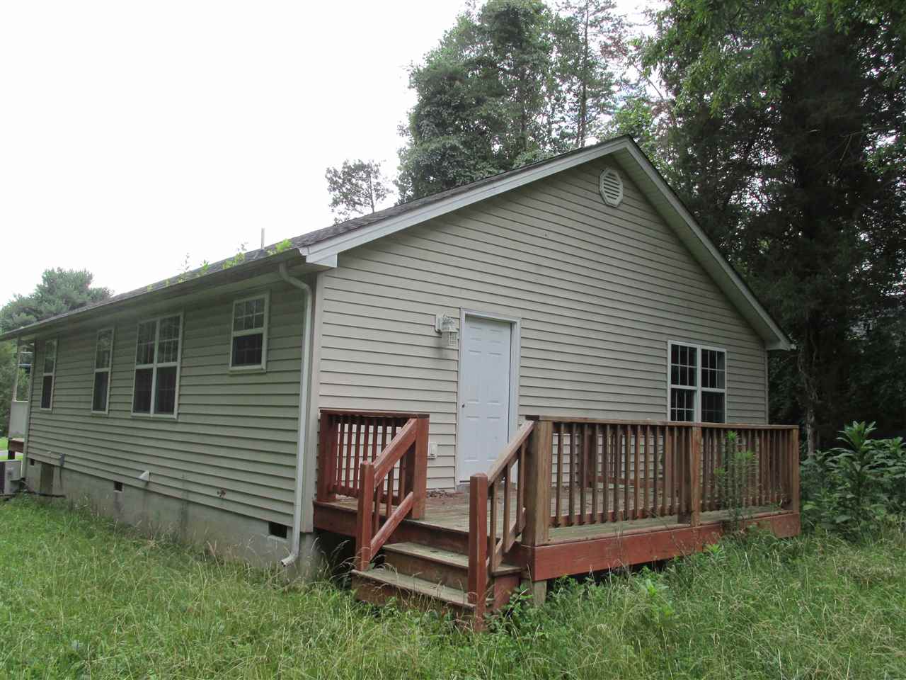 109 Fairview Road Louisa, VA 23093 - Photo 8 of 8 a view of a house with a yard and deck