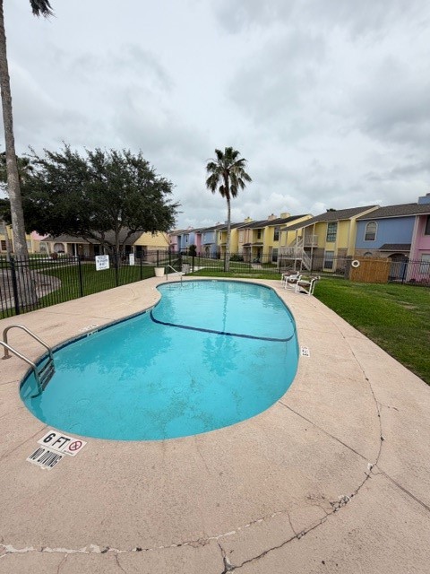 6702 Everhart Road, Unit A107 Corpus Christi, TX 78413 - Photo 13 of 13 a view of a swimming pool with a yard