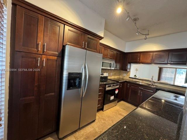 192 Southwest 96th Avenue, Unit 192 Plantation, FL 33324 - Photo 7 of 15 a kitchen with stainless steel appliances granite countertop a refrigerator and a stove
