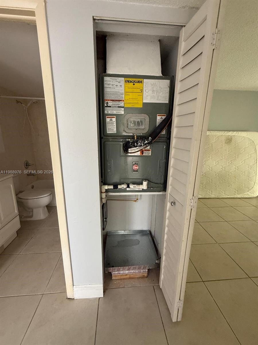 11780 Southwest 18th Street, Unit 2302 Miami, FL 33175 - Photo 14 of 15 a bathroom with a sink and a mirror