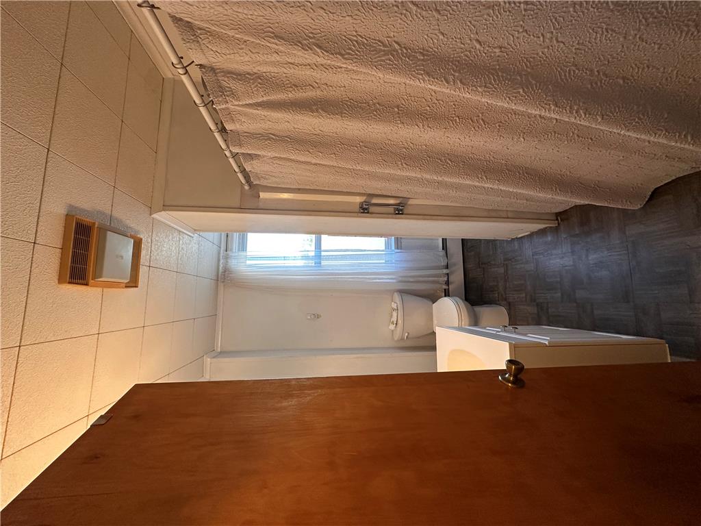 5128 3rd Street Whitehall, PA 18052 - Photo 21 of 26 Well-lit washroom featuring a functional toilet and tile flooring.