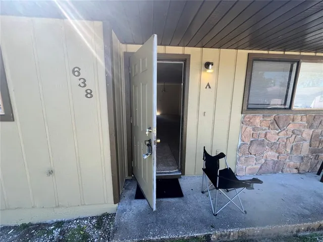 a view of a hallway with paintings on the wall