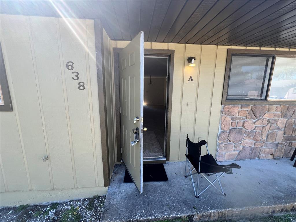 638 LPGA Boulevard, Unit A Daytona Beach, FL 32117 - Photo 1 of 9 a view of a hallway with paintings on the wall