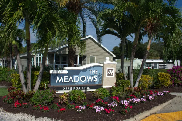 a view of sign board and a yard