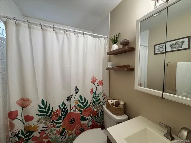 a bathroom with a sink and mirror