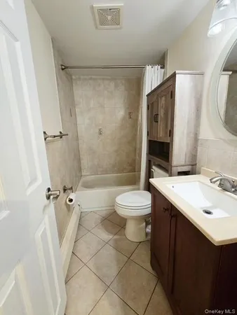 a bathroom with a sink mirror toilet and shower