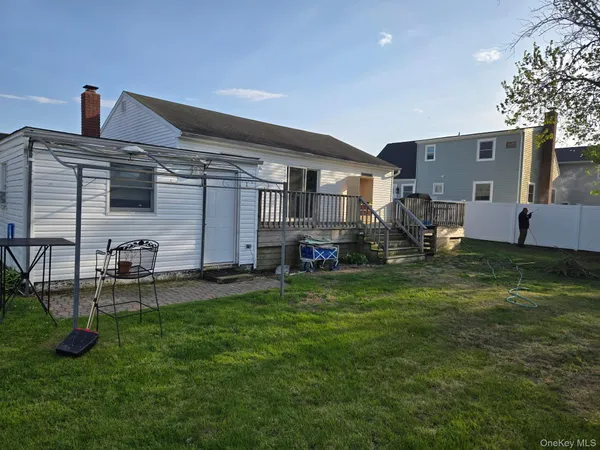 a house view with a sitting space and garden